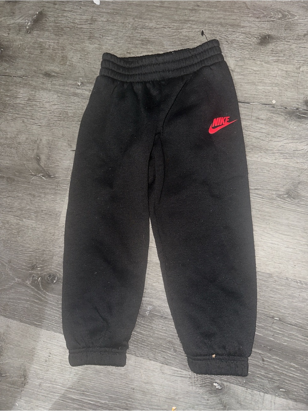 Nike Black Kids Sweatpants with Red Swoosh Logo